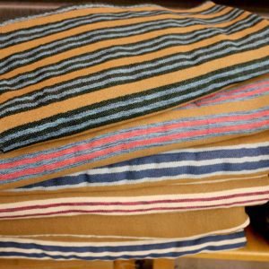 A closeup view of a stack of Acadian style blankets.
